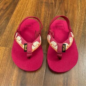 Teva pink elephant flip flops.